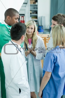 Group of doctors speaking in a hospital