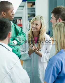 Group of doctors speaking in a hospital