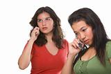 Two female teenagers on the phone