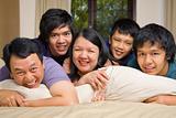 Asian family lifestyle portrait in bedroom