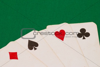 Four old playing cards