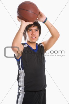 Basketball player is about to throw the ball