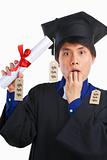 Scholar wear graduation gown surprised in expensive education