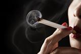 Woman smoking with smoke shaped like skeleton