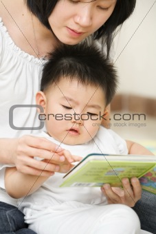 Mother tutoring her son