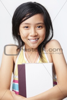Little girl holding book