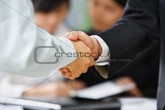 Handshake between employee and boss