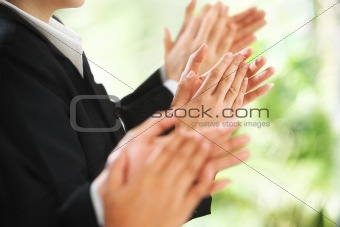 Giving applause over green background