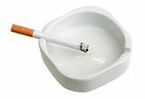 White ashtray with cigarette.