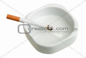White ashtray with cigarette.