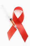 AIDS red ribbon symbol and syringe