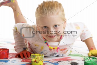 Child smiles during painting session 