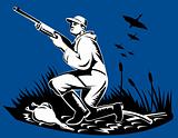 Hunter with rifle and ducks flying