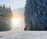 Snow dust dazzle shining on winter skiing slope