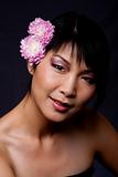 Face of Asian woman with flowers