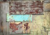 Wall covered with sheets of rusty old steel background