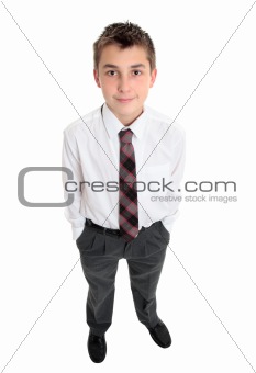 Typical school boy stands in uniform