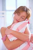 Woman embracing pillow