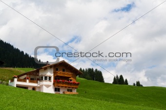 Traditional alpine chalet. Summer time
