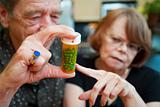 Senior Couple at Home with Prescription