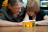 Senior Couple at Home Reading Prescription Labels