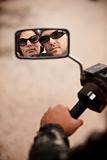 Motorcyclist and Woman Reflection