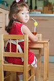 a little girl at a table