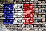 Flag of France painted on an old brick wall