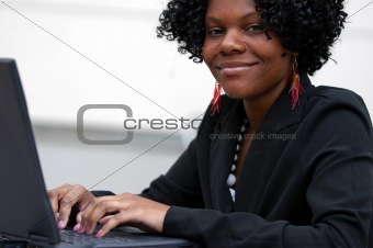 Lady on computer smiles