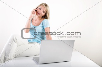 woman with mobile phone and notebook