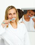 Smiling woman cleaning her teeth with her boyfriend