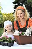 Mother and daughter having gardening time