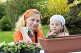 Mother and daughter having gardening time