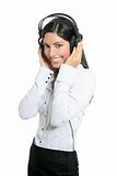 Beautiful brunette businesswoman hearing music
