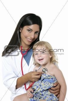 Brunette pediatric doctor with blond little girl