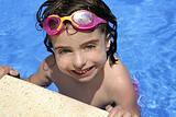 beautiful little girl smiling in pool