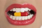 Beauty woman mouth with medicine pill