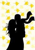 Silhouette of couple on autumn background