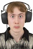 Amusing young man in ear-phones with protruding eyes