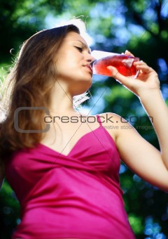 a girl drinks juice