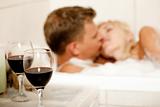 Couple kissing in the bath