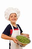 Happy chef with lots of fresh peas