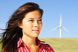 Woman by wind turbine