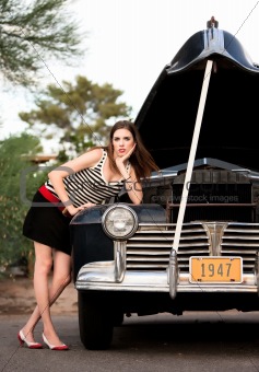 Girl in stripes with vintage car