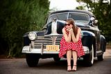 Girl in red with vintage car