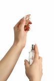 Woman hands with perfume bottle.