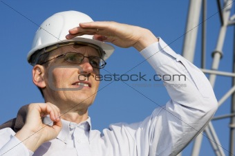 Engineer in front of steel construction