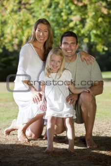 Happy Family Together In A Park