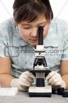 Girl with microscope.