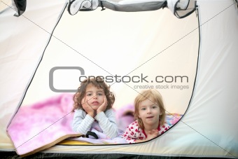 Camping tent vacation with two little girls